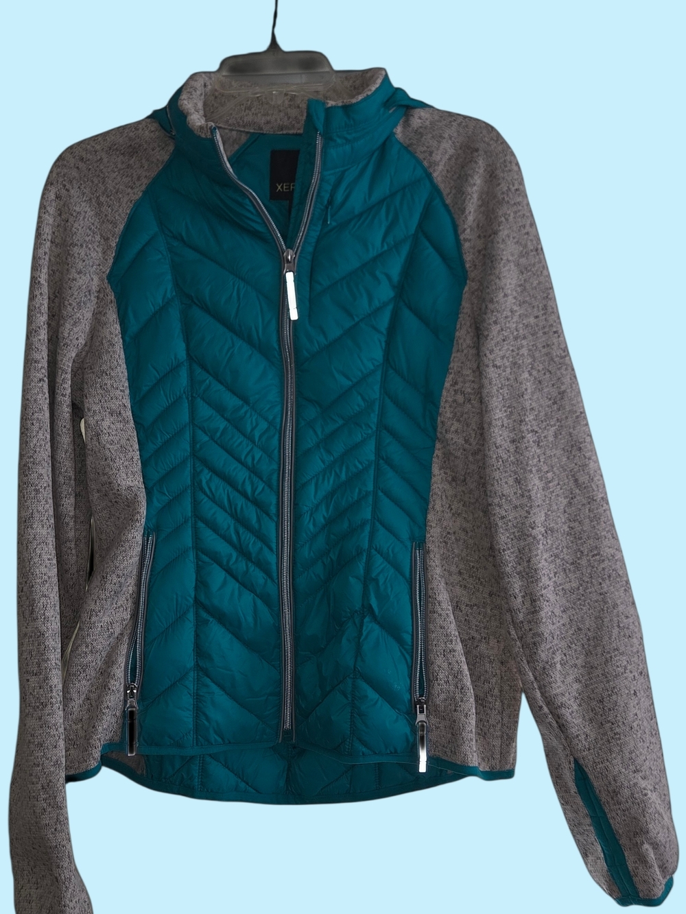 Xersion women's hybrid jacket in teal and gray.